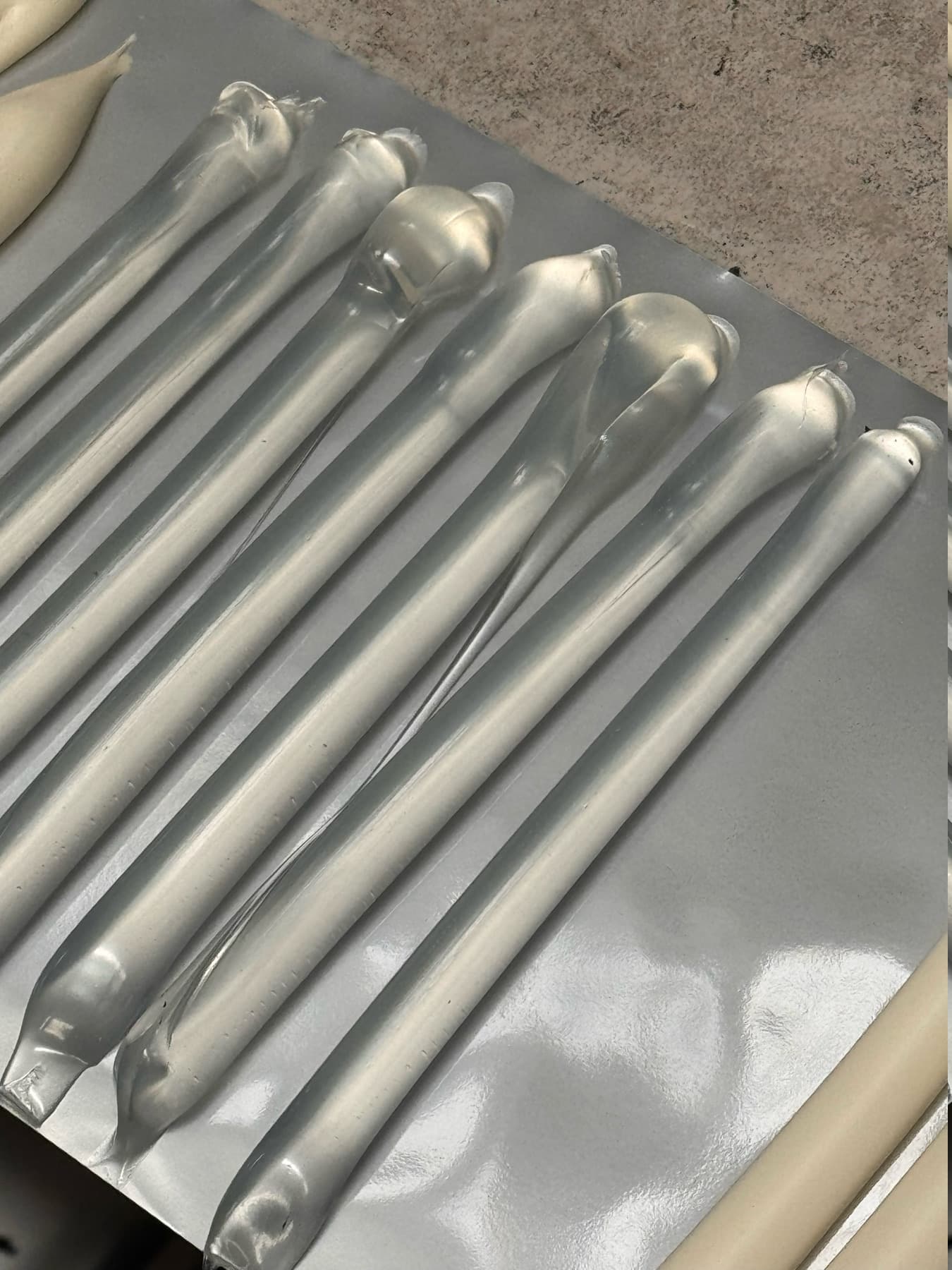 Silver sausage sealant packs after production